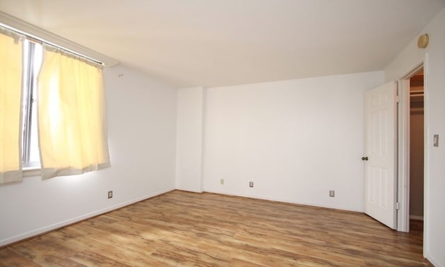 spare room featuring hardwood / wood-style floors