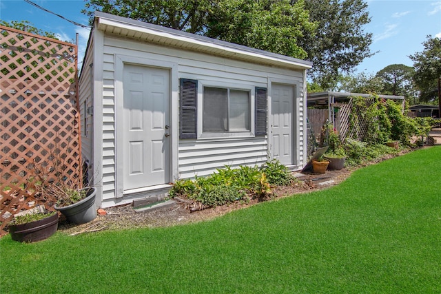 view of outdoor structure featuring a yard