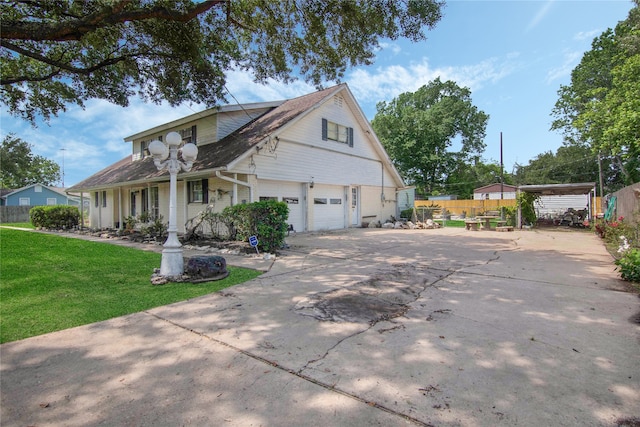 view of property exterior with a yard, a carport, and a porch