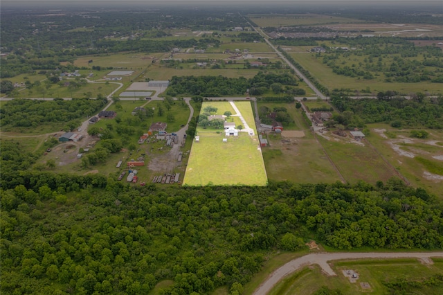 birds eye view of property with a rural view