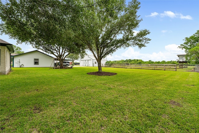 view of yard with a rural view