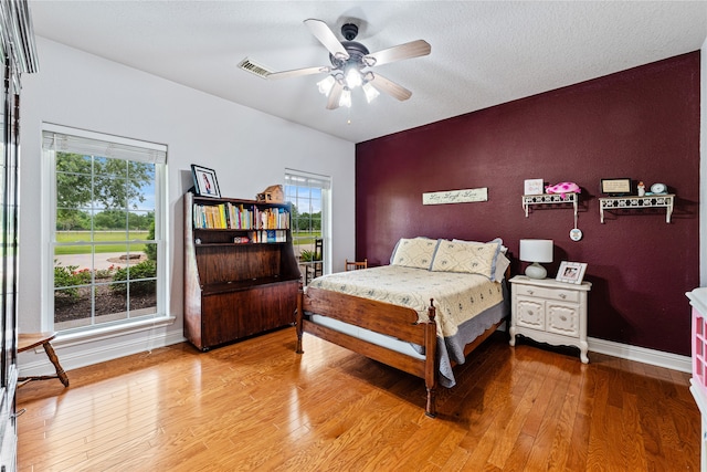 bedroom featuring ceiling fan and wood-type flooring