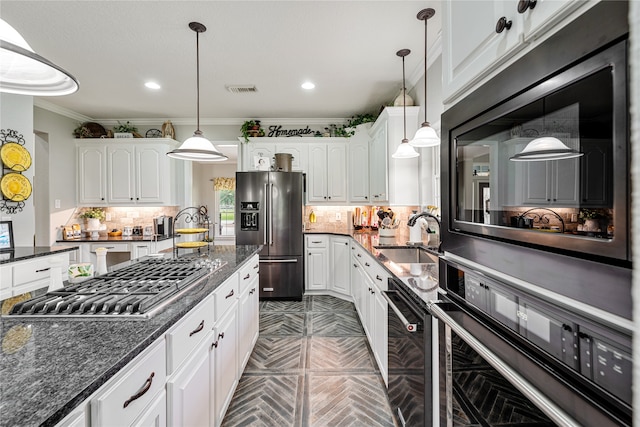 kitchen featuring crown molding, white cabinets, black appliances, and sink