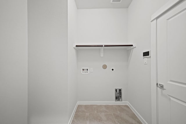 laundry room with hookup for an electric dryer, washer hookup, gas dryer hookup, and light tile patterned flooring