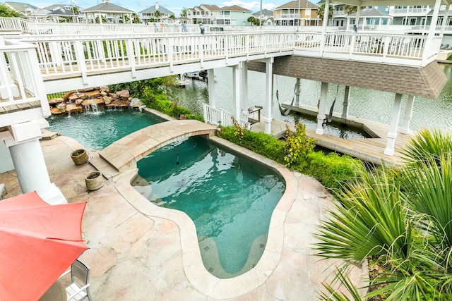 view of pool featuring an in ground hot tub