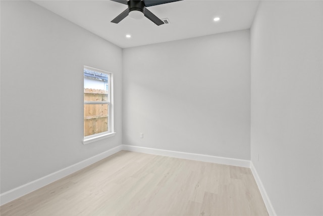 empty room with light hardwood / wood-style flooring and ceiling fan