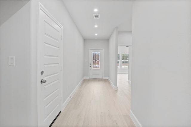 hall with light wood-type flooring