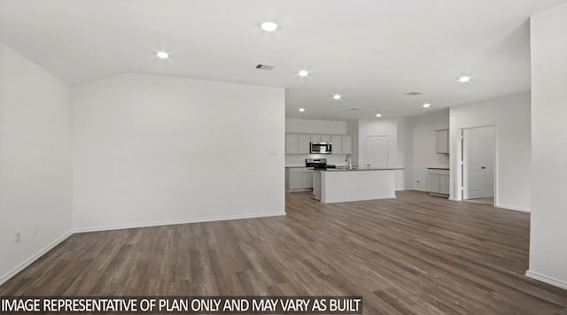 unfurnished living room featuring dark hardwood / wood-style flooring, vaulted ceiling, and sink