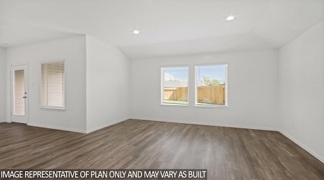 empty room featuring dark hardwood / wood-style flooring and lofted ceiling