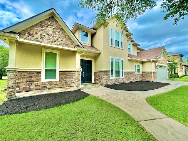 craftsman house with a garage and a front yard