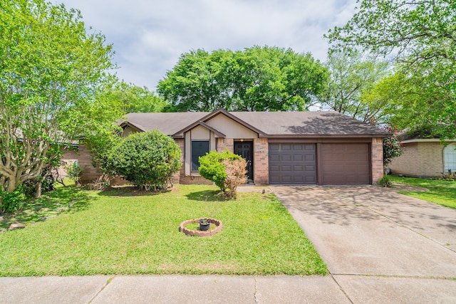 view of front of property featuring a garage and a front yard