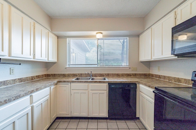 kitchen featuring white cabinets, black appliances, sink, and light tile flooring