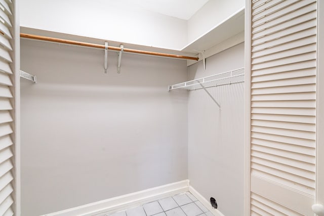 spacious closet featuring tile floors