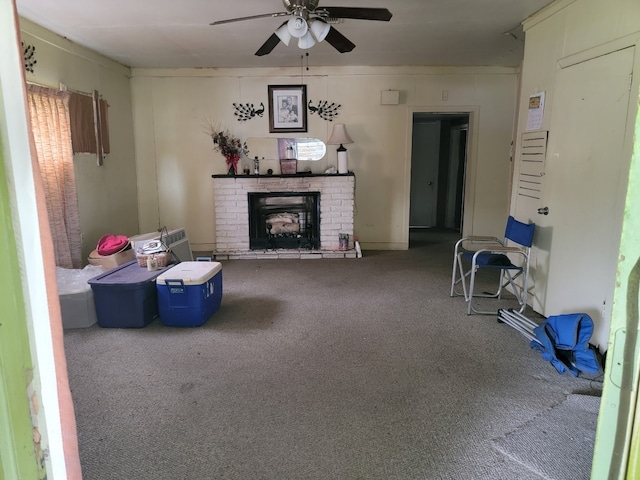 interior space with ceiling fan, carpet, and a brick fireplace