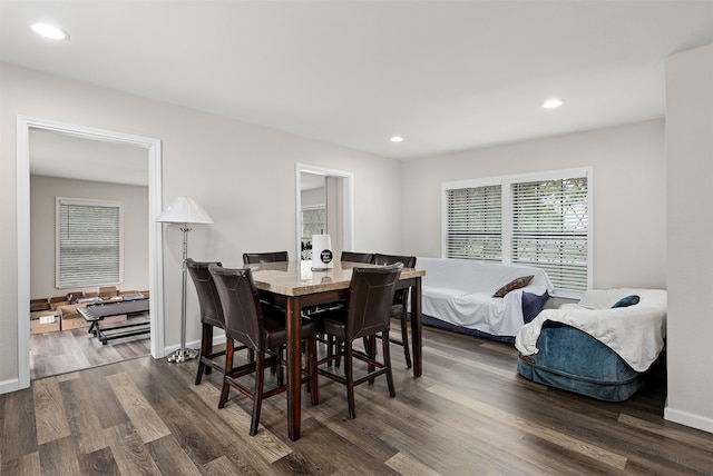 dining area with dark hardwood / wood-style floors