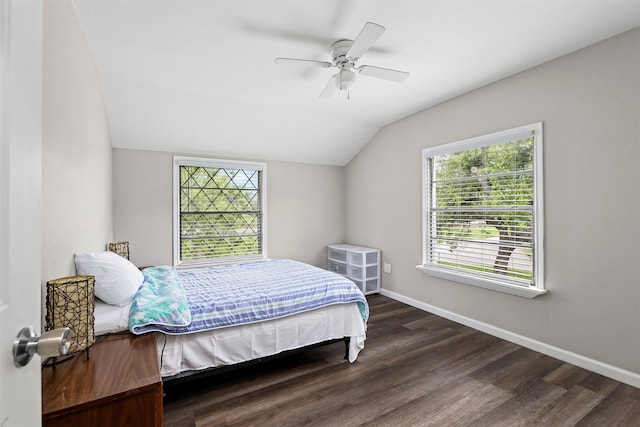 bedroom with dark hardwood / wood-style flooring, ceiling fan, and vaulted ceiling