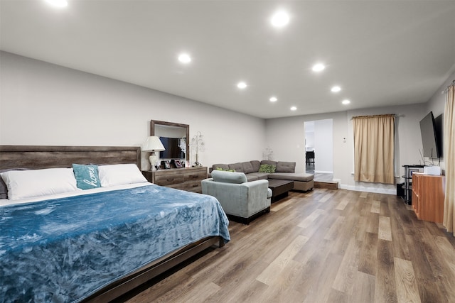 bedroom with hardwood / wood-style floors