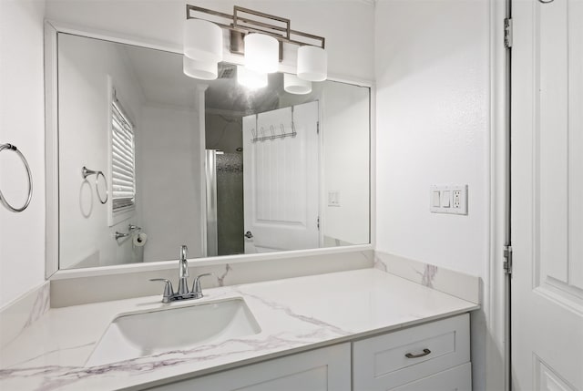 bathroom featuring vanity with extensive cabinet space