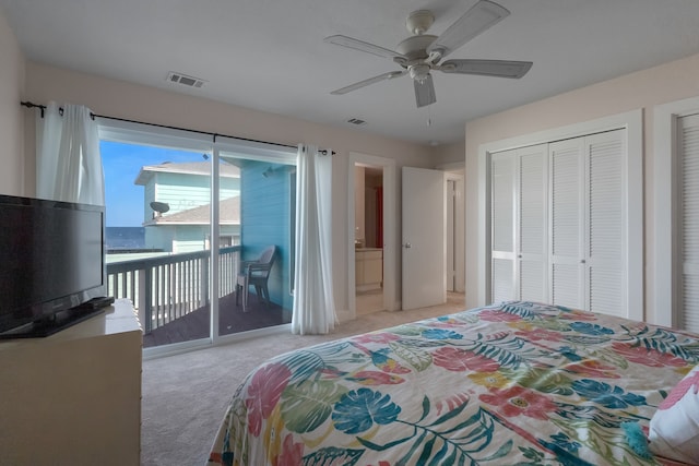 bedroom with light colored carpet, a closet, multiple windows, and access to outside