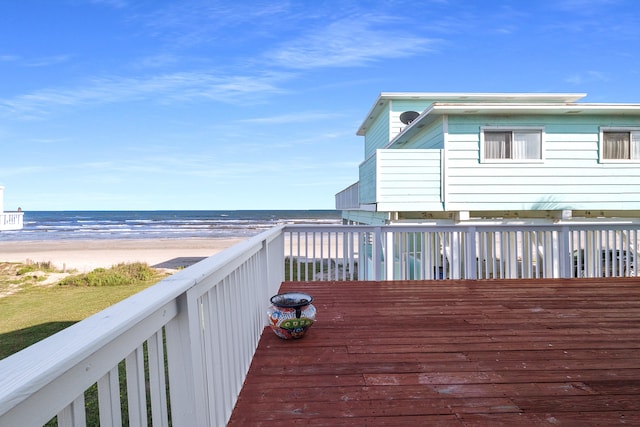 deck with a water view and a view of the beach