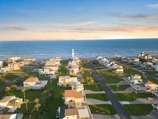 aerial view at dusk with a water view