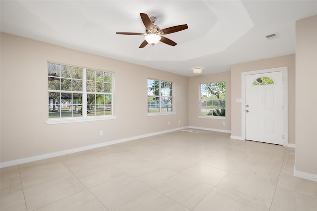 entryway with light tile patterned flooring and ceiling fan