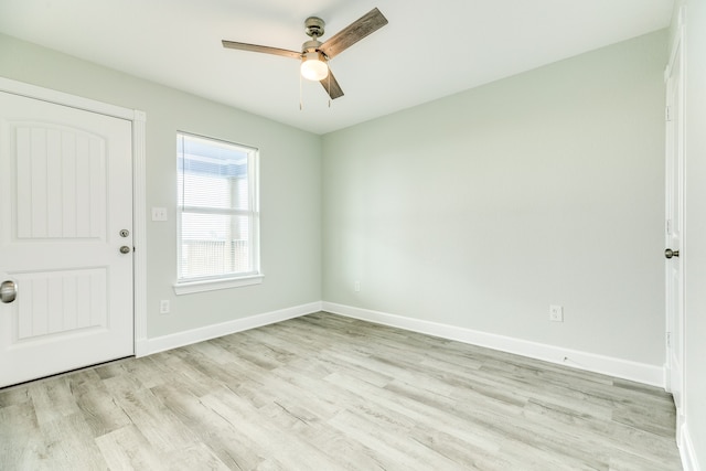 unfurnished room with ceiling fan and light hardwood / wood-style floors