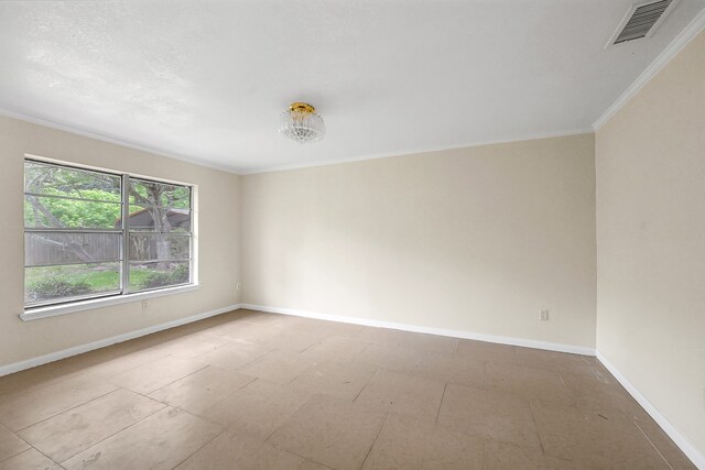 tiled empty room with crown molding