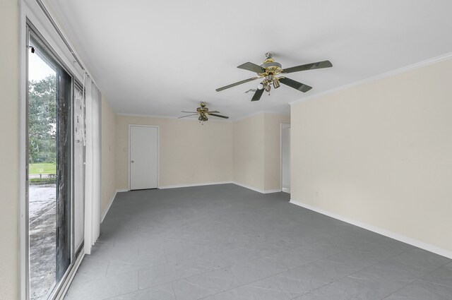 empty room featuring plenty of natural light, ceiling fan, and tile floors