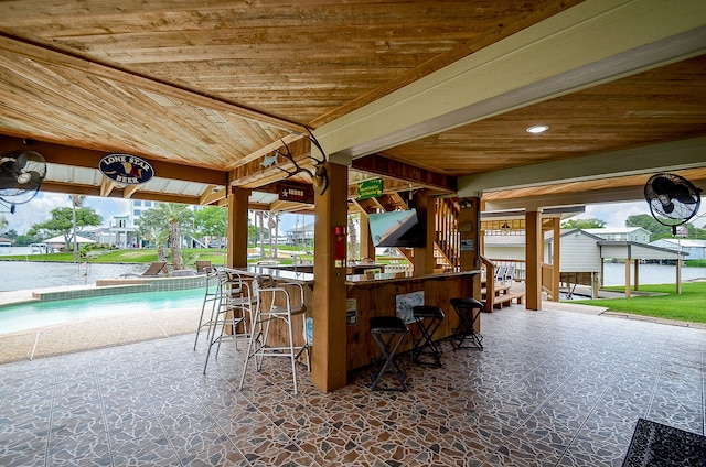 view of patio with a gazebo and an outdoor bar