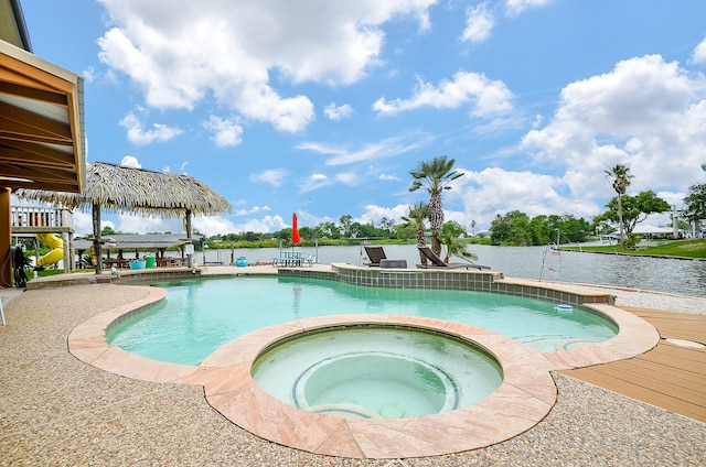 view of pool featuring an in ground hot tub