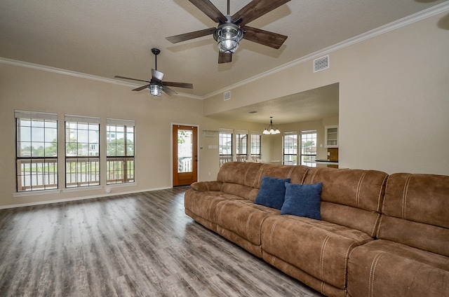 living room featuring a wealth of natural light, ceiling fan, crown molding, and hardwood / wood-style flooring