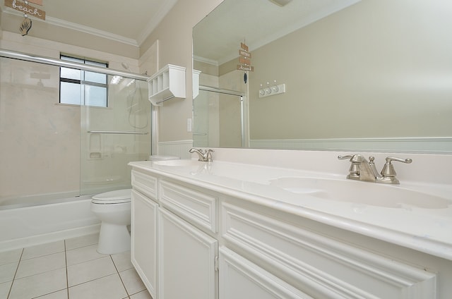 full bathroom with vanity with extensive cabinet space, tile floors, enclosed tub / shower combo, dual sinks, and toilet