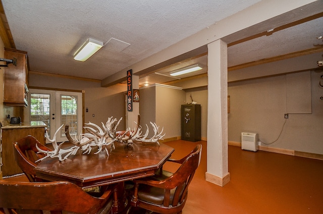 dining area featuring french doors and a textured ceiling