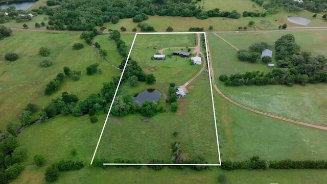 bird's eye view featuring a rural view and a water view