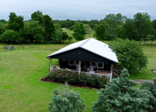 exterior space with a front yard and covered porch