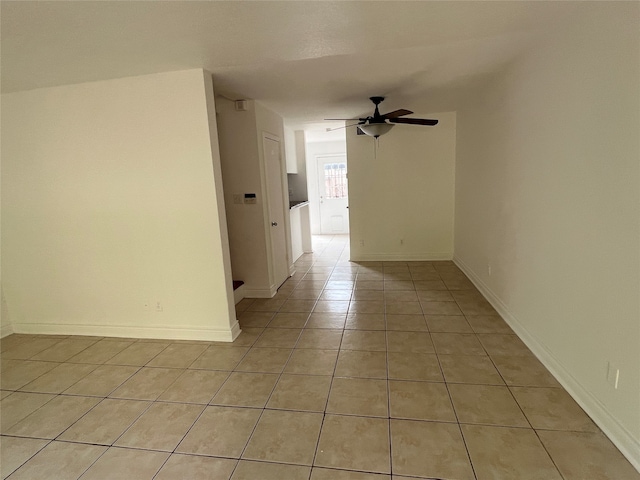 tiled empty room with ceiling fan