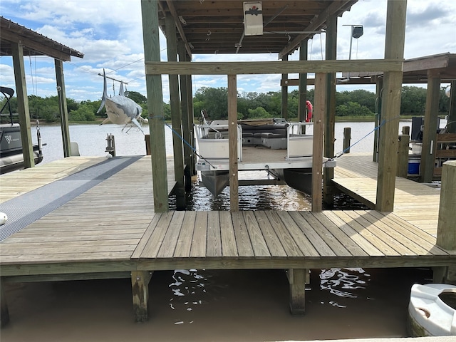 dock area featuring a water view