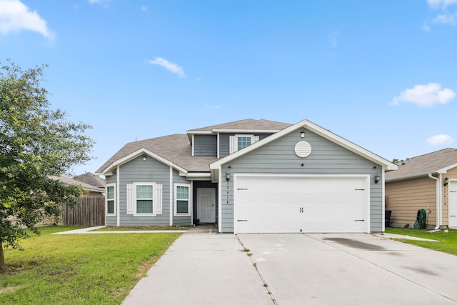 view of front of property featuring a garage and a front lawn