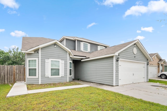 view of front of property with a garage and a front yard