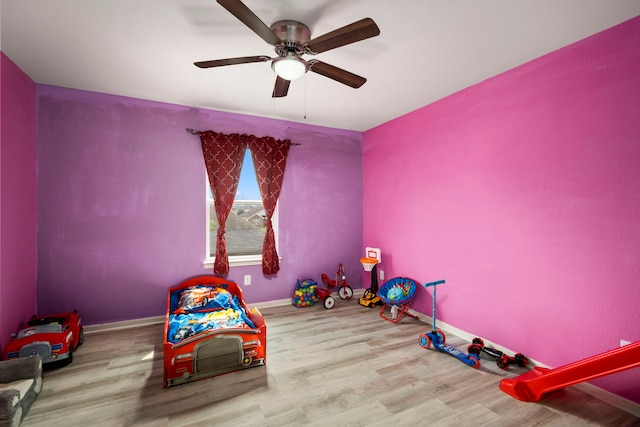 recreation room with hardwood / wood-style floors and ceiling fan