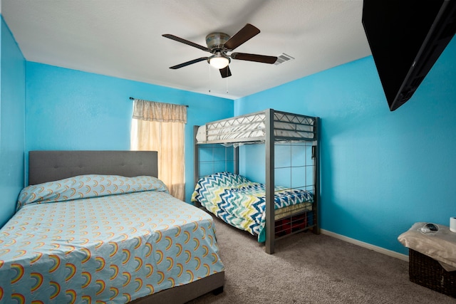 bedroom with ceiling fan and carpet flooring