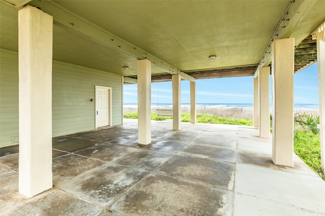 view of terrace with a water view