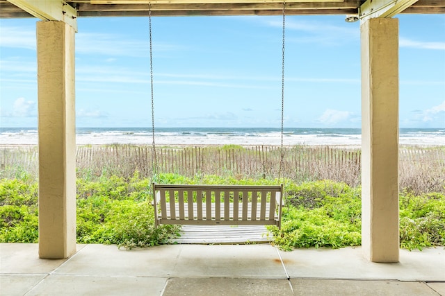 exterior space with a beach view and a water view