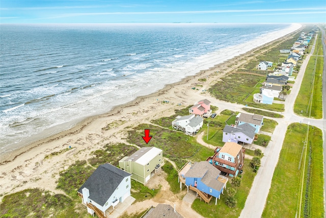 drone / aerial view featuring a view of the beach and a water view