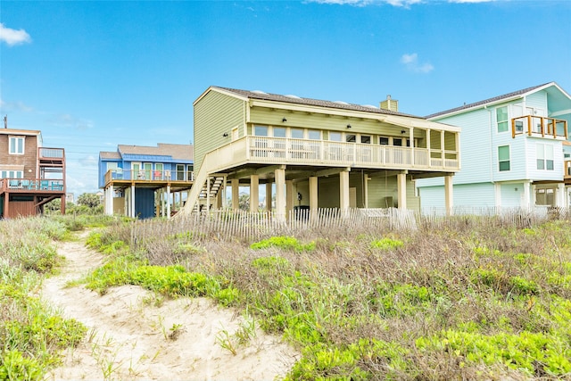 rear view of property featuring a deck