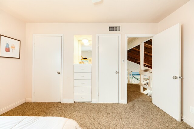 unfurnished bedroom with carpet