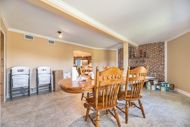 dining room featuring brick wall and crown molding