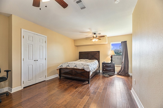 bedroom featuring ceiling fan and dark hardwood / wood-style floors