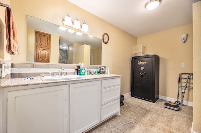 bathroom with vanity and tile patterned flooring